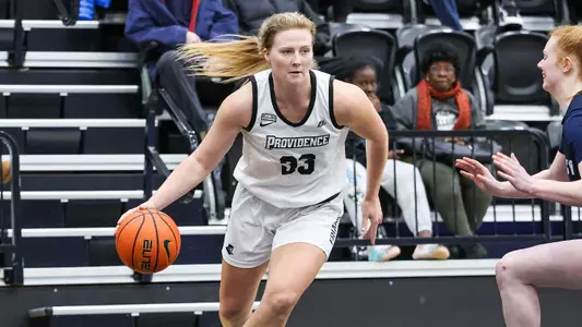 Emily Archibald - women's basketball action photo vs. Mercy