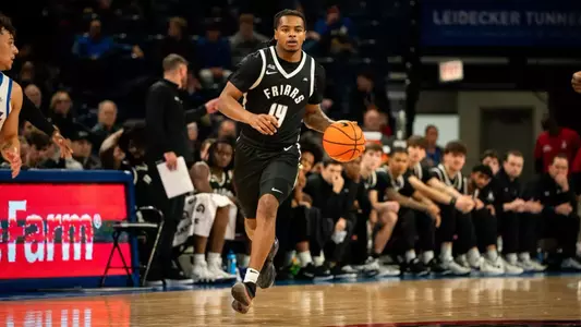 Corey Floyd Junior dribbles ball down court in game against DePaul at the Amica Mutual Pavilion 2025 season