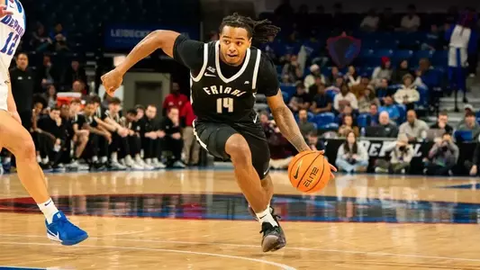 Corey Floyd Junior charges the hoop in game against DePaul at the Amica Mutual Pavilion 2025 season