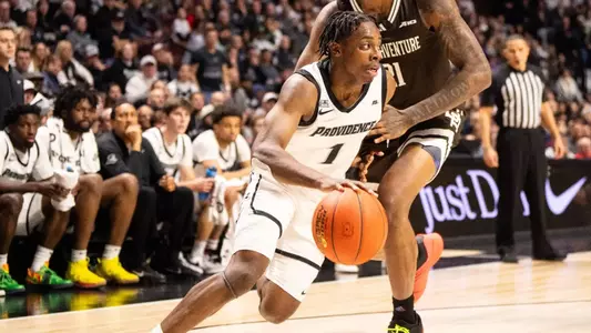Jayden Pierre dribbles ball away from defense in game against Saint Bonaventure at the Amica Mutual Pavilion 2025 season