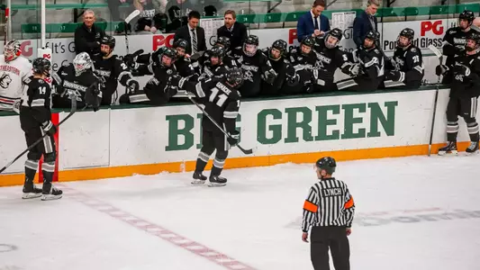 Providence College Men's Ice Hockey player Graham Gamache celebrates with the bench after scoring against Dartmouth.