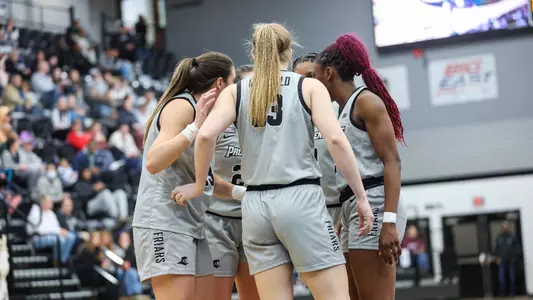 Providence College women's basketball group huddle during a basketball game vs Xavier