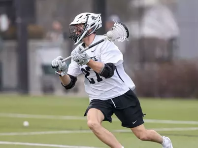 Parker Kennedy cradling the ball making a move towards goal in 2024 game