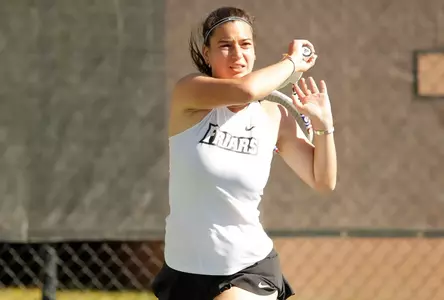 Tennis player Camila Barrera swings her racket after hitting a ball in a 2024 outdoor match.