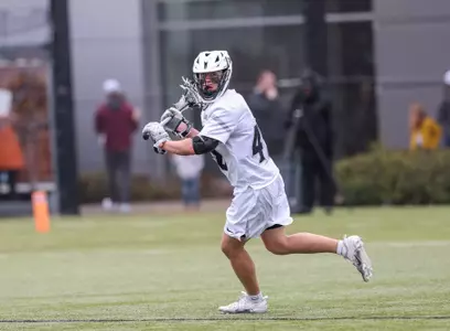 Scott Wetsrick preparing to make pass in 2024 home game at Chapey Field in Anderson Stadium