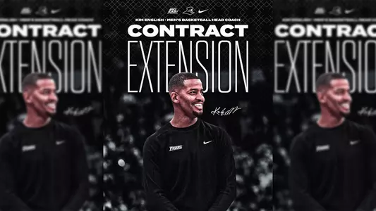 Contract Extension Kim English Men's Basketball Head Coach Providence College Friars; picture of Kim English smiling while coaching