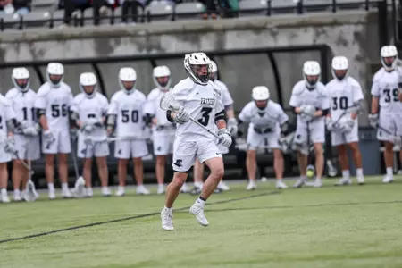 Chris Cusolito cradles down Chapey Field in Anderson Stadium in 2024 home game