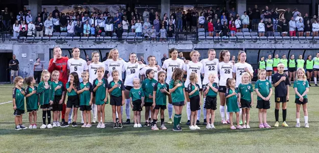 Women's Soccer vs URI Pregame standing for the national anthem