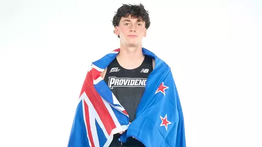 Elliot Pugh Posed with New Zealand flag wrapped around shoulders