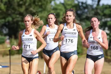 Shannon Flockhart, Cara Laverty, Laura Mooney and Emily Bush run at the 2024 Friar Invitational
