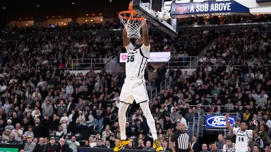 Men's Basketball player Oswin Erhunmwunse dunking the ball against Seton Hall at the Amica Mutual Pavilion in 2025