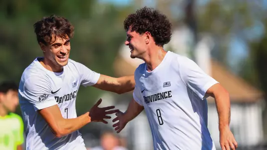 Fernando Garcia Gil and Bruno Rosa celebrate a goal together at a home match against Villanova