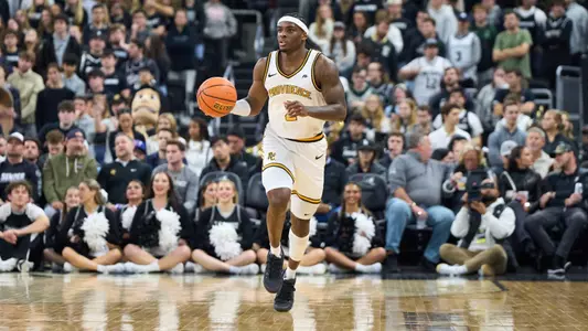 Jaylin Sellers dribbles the ball up the court versus Penn at the Amica Mutual Pavilion.