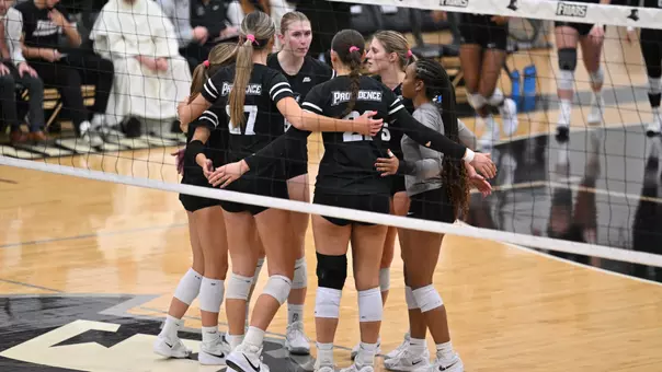 Volleyball Team Huddle on the court at Alumni Hall in Providence, R.I. during a conference game against Xaver