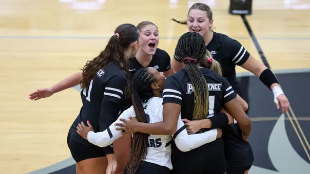 Volleyball Team Huddle and Celebration at Alumni Hall in Providence, R.I. during a non conference match against New Haven.