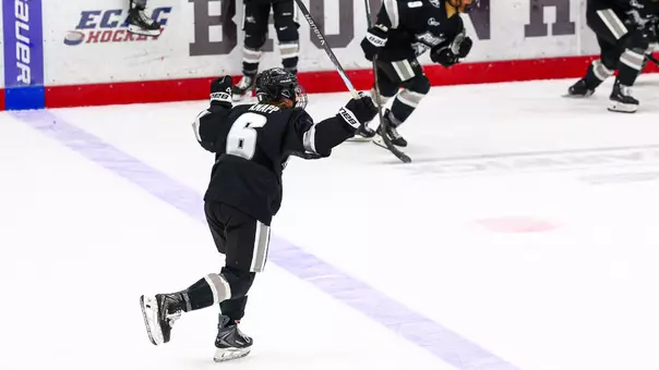 Women's ice hockey player Audrey Knapp celebrating scoring the game winning goal in overtime against Brown University