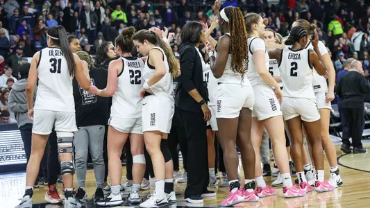Huddle Photo - women's basketball team vs. UConn at The AMP