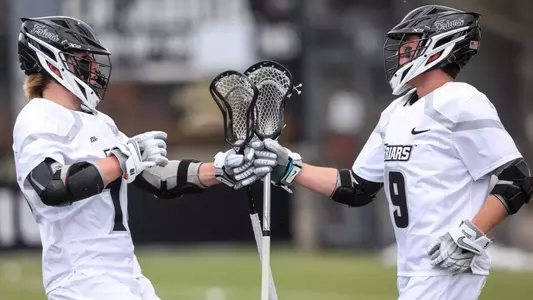 Jack Horrigan and Richie Joseph fist bump celebration versus Holy Cross