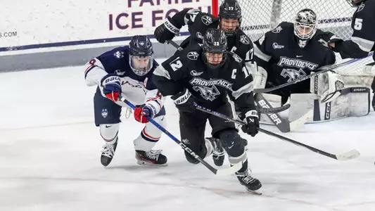MIH - Nick Poisson skating to the puck against Uconn in the 2024-2025 season