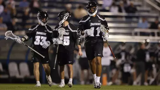 Stone Evans, Chris Simonton and Jay Wilkerson on the field at Duke.