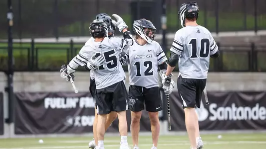 Men's Lacrosse Celebration after scoring a goal.