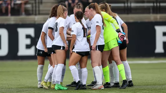 Women's Soccer Huddle in a game in 2024 at Chapey Field at Anderson Stadium.