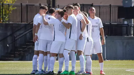 Men's Soccer vs SJU (10/19) team huddle action shot