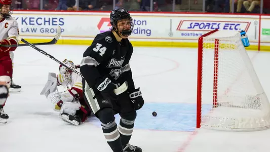 Men's Hockey's Logan Sawyer Celebrates his overtime goal at Boston College