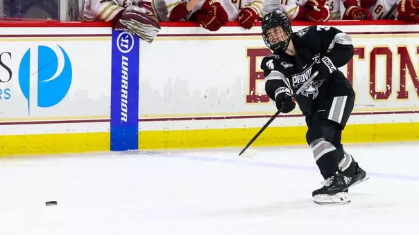 Women's ice hockey player Cali Cerruti taking a shot during a game against Boston College