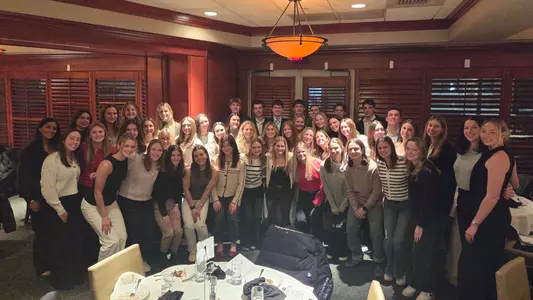 A group photo comprised of 51 Providence College student-athletes who were inducted into Chi Alpha Sigma
