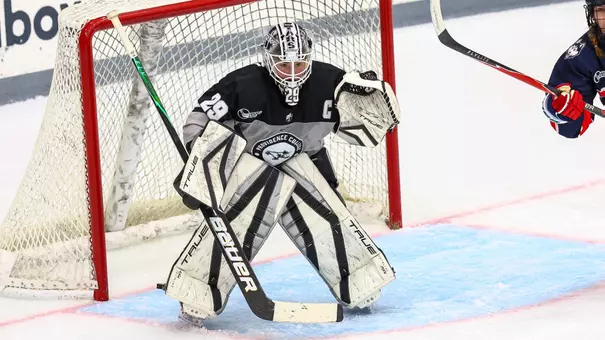 Women's ice hockey goalie Hope Walinski preparing to make a save during a game