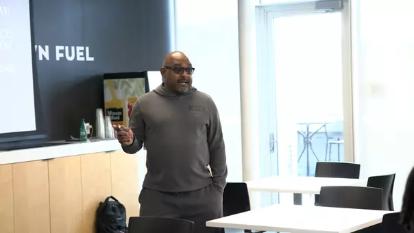 Former basketball player Stevin Smith speaking to the Friar men's and women's basketball teams on sports betting education