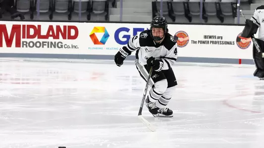 Mirella Martinelli is pictured in possession of the puck at Schneider Arena during their game against Sacred Heart.