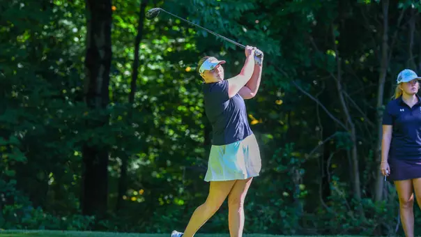 Women's golfer Myla Bisceglia hitting a tee shot