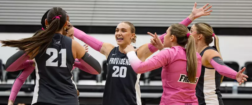 Volleyballll celebrating a point against UConn