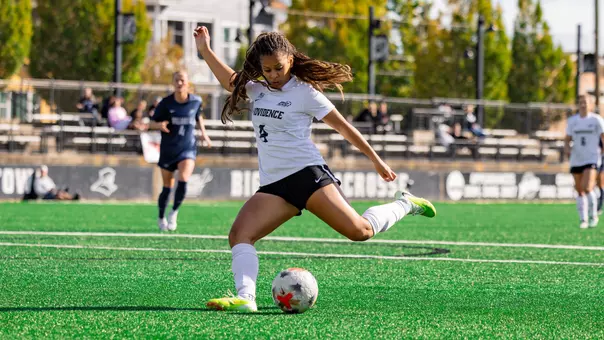 Amaya Coffie winding up to kick the ball vs. Villanova