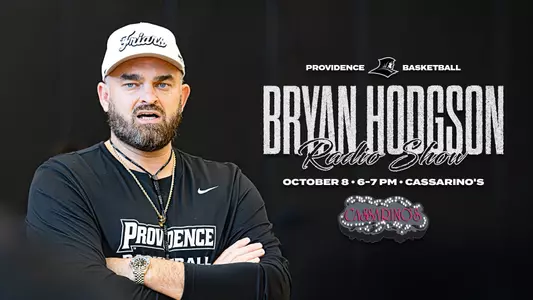 Bryan Hodgon Radio Show October 8 at Cassarino's, 6 to 7 pm, Bryan Hodgson with his arms folded wearing a white Friars hat during practice
