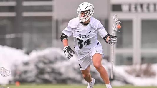 Owen Finetto runs with the ball versus Bryant on Chapey Field at Anderson Stadium.