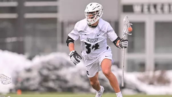 Owen Finetto runs with the ball versus Bryant on Chapey Field at Anderson Stadium.