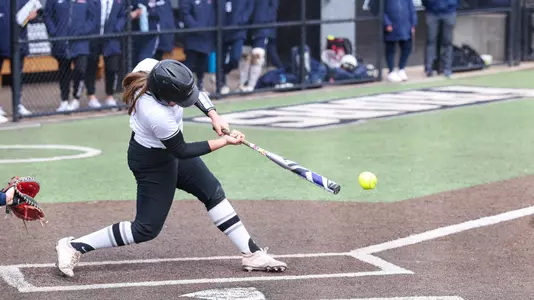 Sofia Peterson swinging during a 2025 BIG EAST game against UConn at Glay Field in Providence, R.I.