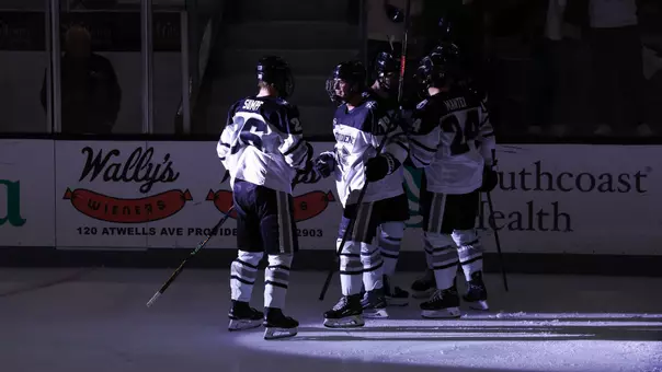 Men's Hockey Team celebrates a goal against Boston College