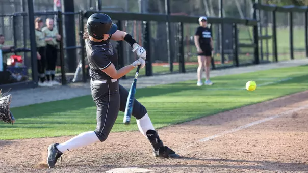 Cameron Dunn swinging during a 2025 game against Bryant University at Glay Field in Providence, R.I.