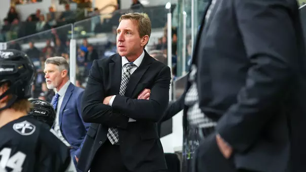 Men's Hockey Head Coach Nate Leaman behind the bench at Schneider Arena