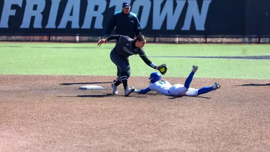Dominique Gallardo tags out runner during a Big East conference matchup between Depaul and Providence held at Glay Field. Photo by Brian Foley for Foley Photography