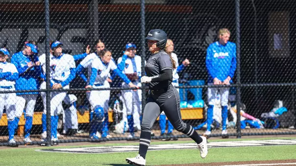 Becca Weaver rounds home during a Big East conference matchup between Depaul and Providence held at Glay Field. Photo by Brian Foley for Foley Photography