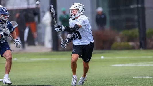 Jack Bonello passes the ball from X versus Georgetown at Chapey Filed at Anderson Stadium.
