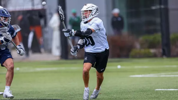 Jack Bonello passes the ball from X versus Georgetown at Chapey Filed at Anderson Stadium.