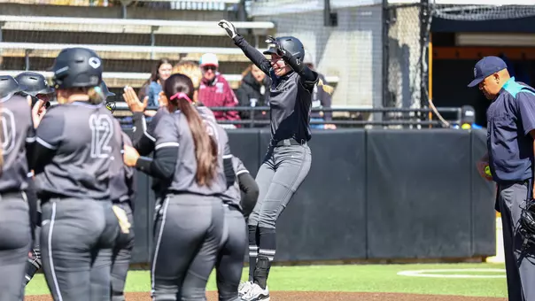 Brianna De La Fuente celebrates a home run.