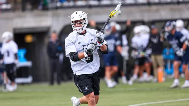 Men's lacrosse player Rhett Chambers looks to shoot the ball on Chapey Field at Anderson Stadium.