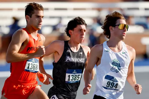 Elliott Pugh NCAA East First Round running in the 1500 meter race, in the middle of two other runners
